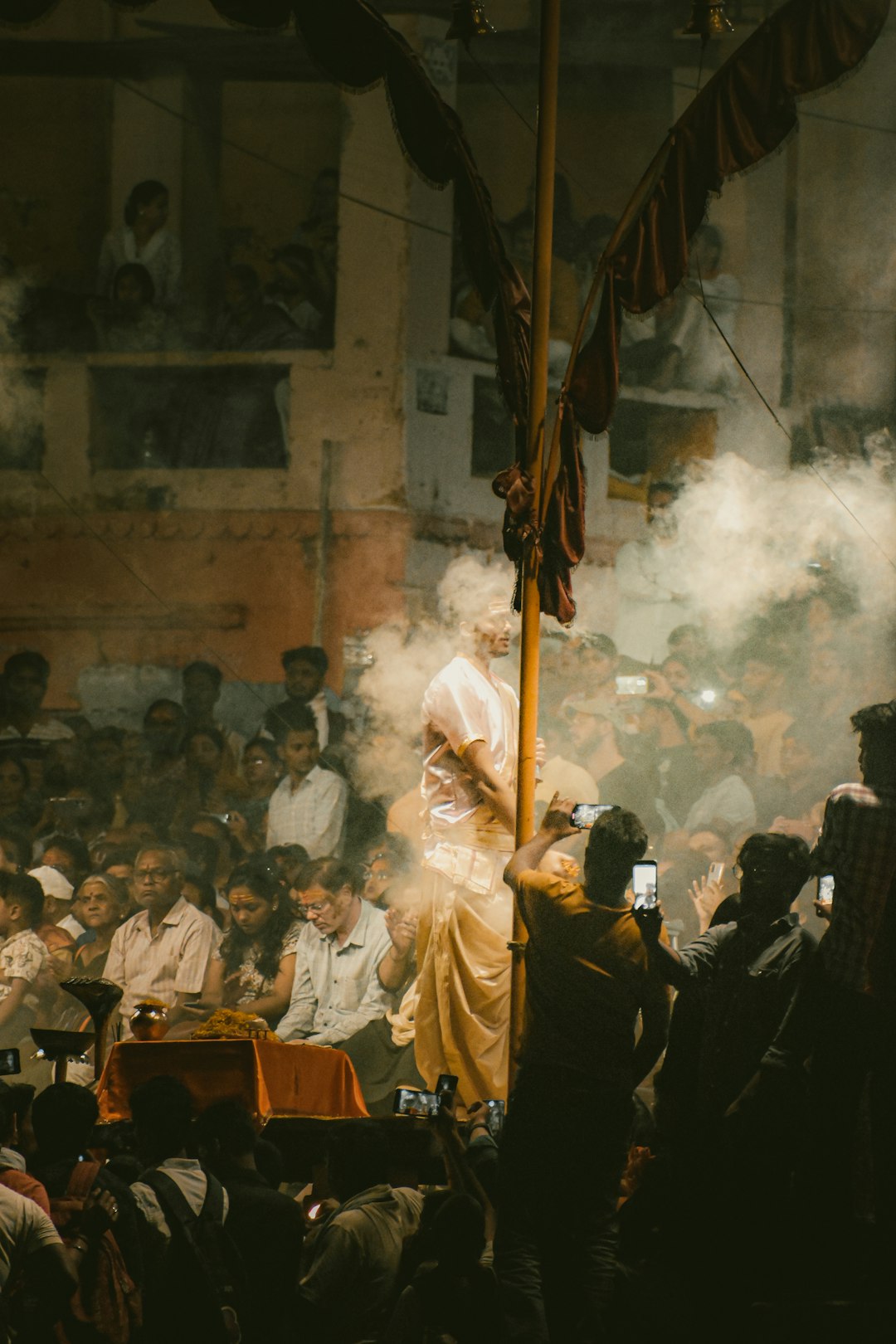 a-crowd-of-people-standing-around-a-flag-pole-5ckypsldiik